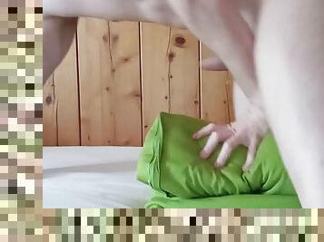 A young guy fucks his pillow and moans a lot