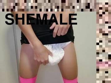 Sissy wears a diaper under her skirt