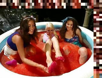 Hot babes have foot fetish fun in a pool filled with jell-o