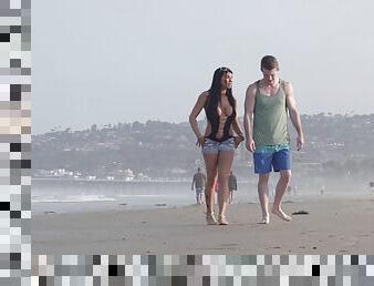 Young couple takes a walk on the beach and stops for a outdoor fuck