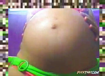 Busty preggy in bikini amusing her webcam watchers