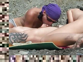 Two beauties are sucking dick outdoors