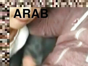 Arab couple in the car phone