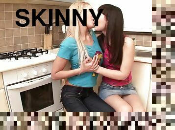 Skinny girls finger each others pussies in the kitchen
