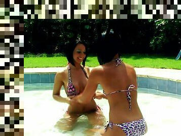 Irresistible round tit lesbians have fun in the pool during the summer