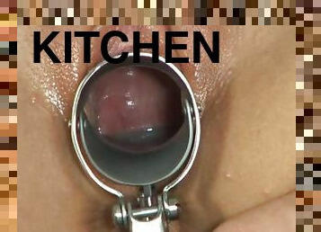 Slim and sexy Bambi toys her pussy and pisses in the kitchen