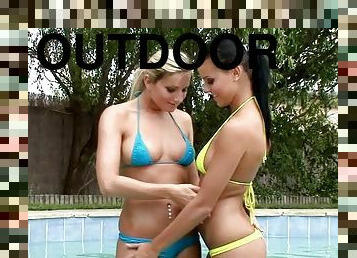 Two hot girls in bikinis fuck each other in the backyard