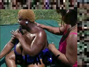 Black BBWs outdoors having sex on a blanket