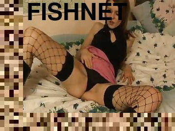 Amazing babes in fishnet stocking unpinning her thong showcasing her nice ass