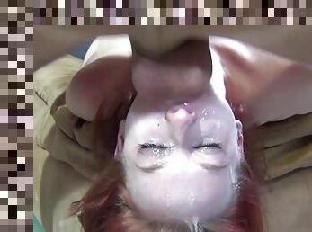 Redhead babe takes the dick as deep inside her mouth as she can