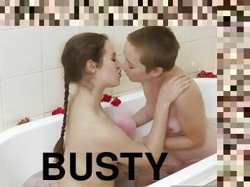 Busty hairy chick licked in the bath