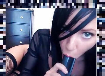 Dark-haired Catie Minx is sucking black dildo