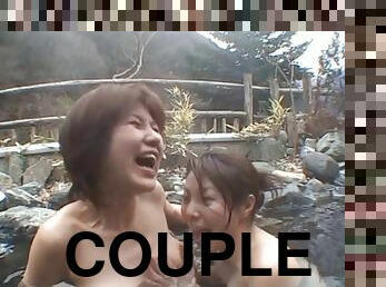 A couple of Japanese women eat pussy while in an outdoor spa