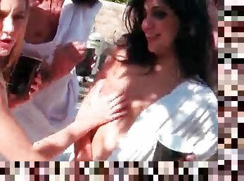 Outdoor toga party gets naughty with foreplay