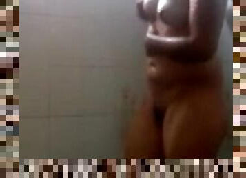 Amateur lady strokes her wet body in the shower in homemade tape
