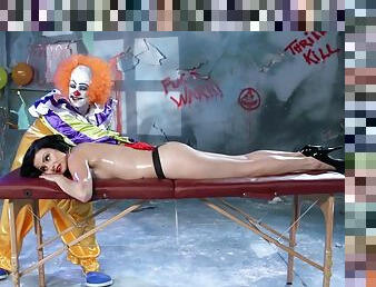 A creepy clown gives this girl a massage then fucks her