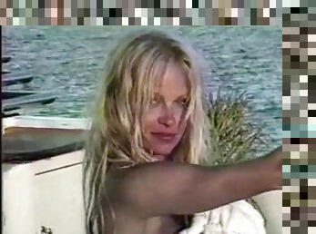 Famous Pamela Anderson having a taste of her boyfriend's penis