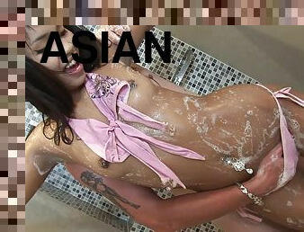 Charming Asian dame with small tits getting her pussy fingered in the shower