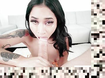 Throated brunette Asian slurps and sucks a huge cock