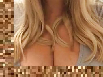 Blonde milf showing off her huge boobs
