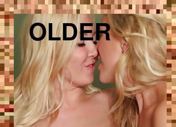 An Adorable Slim Blonde Offers Her Tight Pussy To An Older Lesbian Friend