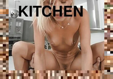 Blonde slut Evelyn Payne gives head and gets screwed in the kitchen