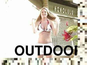 Hot solo girl in a bikini has fun in Honolulu zoo