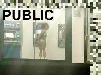 Sissy in slutty dress masturbating her ass in public ATM with dildo at night