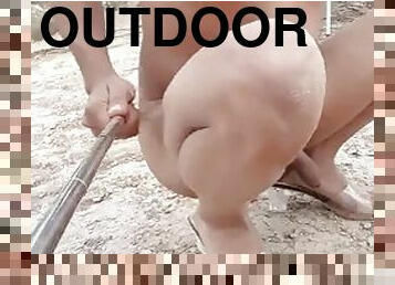 Cute trans plays naked with her feet and ass outdoors, enjoy