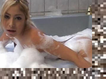 Asian blonde is posing naked in the bathroom