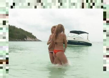 Lesbians in bikinis French kiss on the beach and fuck on the boat