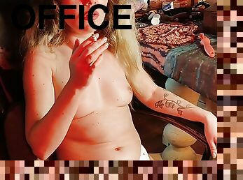 NAKED SECRETARY SMOKES AT NIGHT IN THE OFFICE