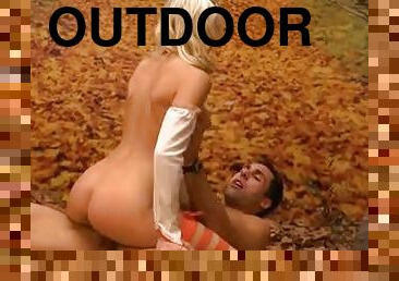 Erotic scene in the woods with blonde angel