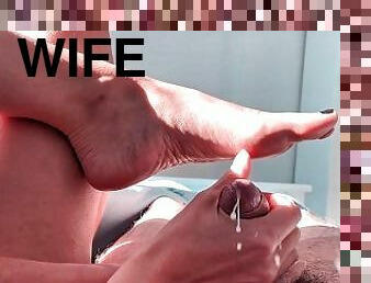 A quick handjob with feet view and a lot of cum