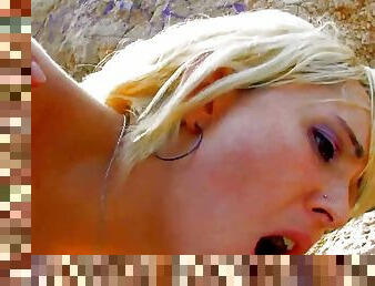 A beautiful German blonde enjoys a deep anal fuck on the beach