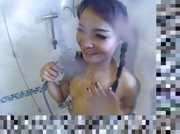 Thai girlfriend with pigtails gets a creampie in bed