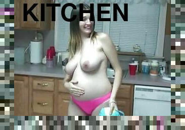 Pregnant girl makes a mess in the kitchen