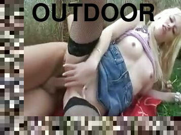 Girl in a wide open field sucks and fucks outdoors