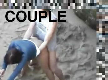 Couple filmed messing around on the beach