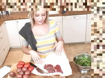 Bree Olson flashes her great smile while cooking some food