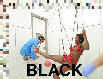 Black girl in red rope bondage played with by dom guys