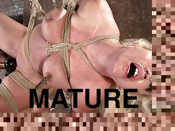 Big Bust Mature toyed in hogtie suspension