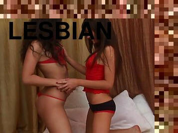 Tantalizing babe moans as her cunt is filled with a monster dildo in this lesbian scene