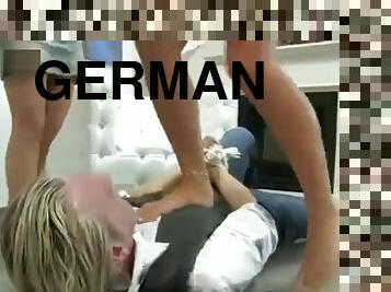 German sisters torturing weak guy with their shoes and smelly feet