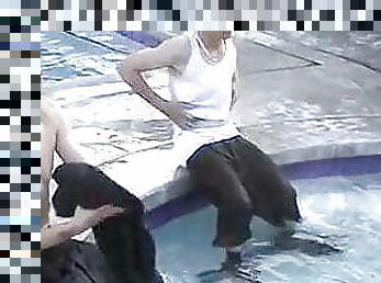 Four dudes get wet in a pool before having group spank
