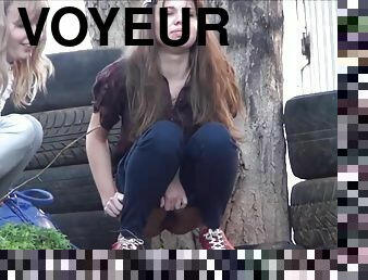 Voyeur spying girls pissing outdoor