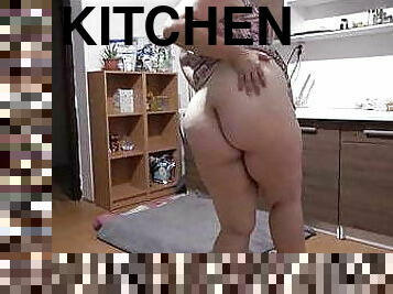 Phat ass girl masturbates with cucumber in kitchen