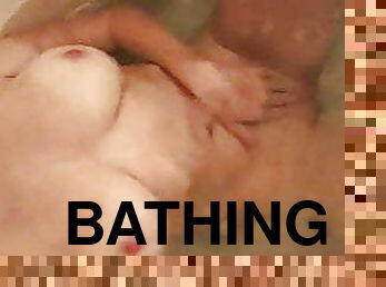 Touching herself in the bath