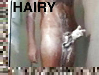 Hairy guy is soaping himself in the shower