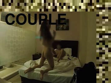 Teen couple has fun in a hotel room